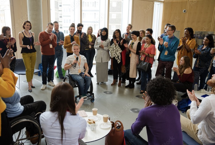 Diverse group in community meeting or organizers working together